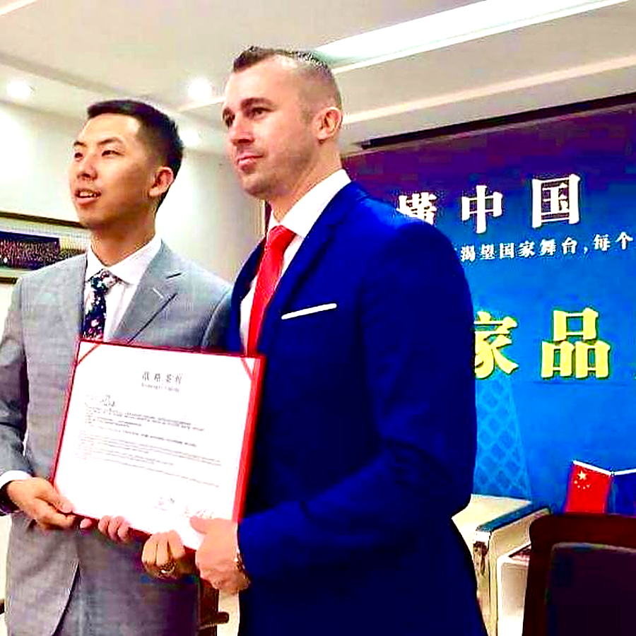 Brock Gillespie at a signing ceremony in China