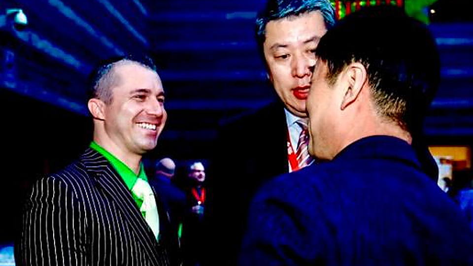 Brock Gillespie shaking hands at an event in China